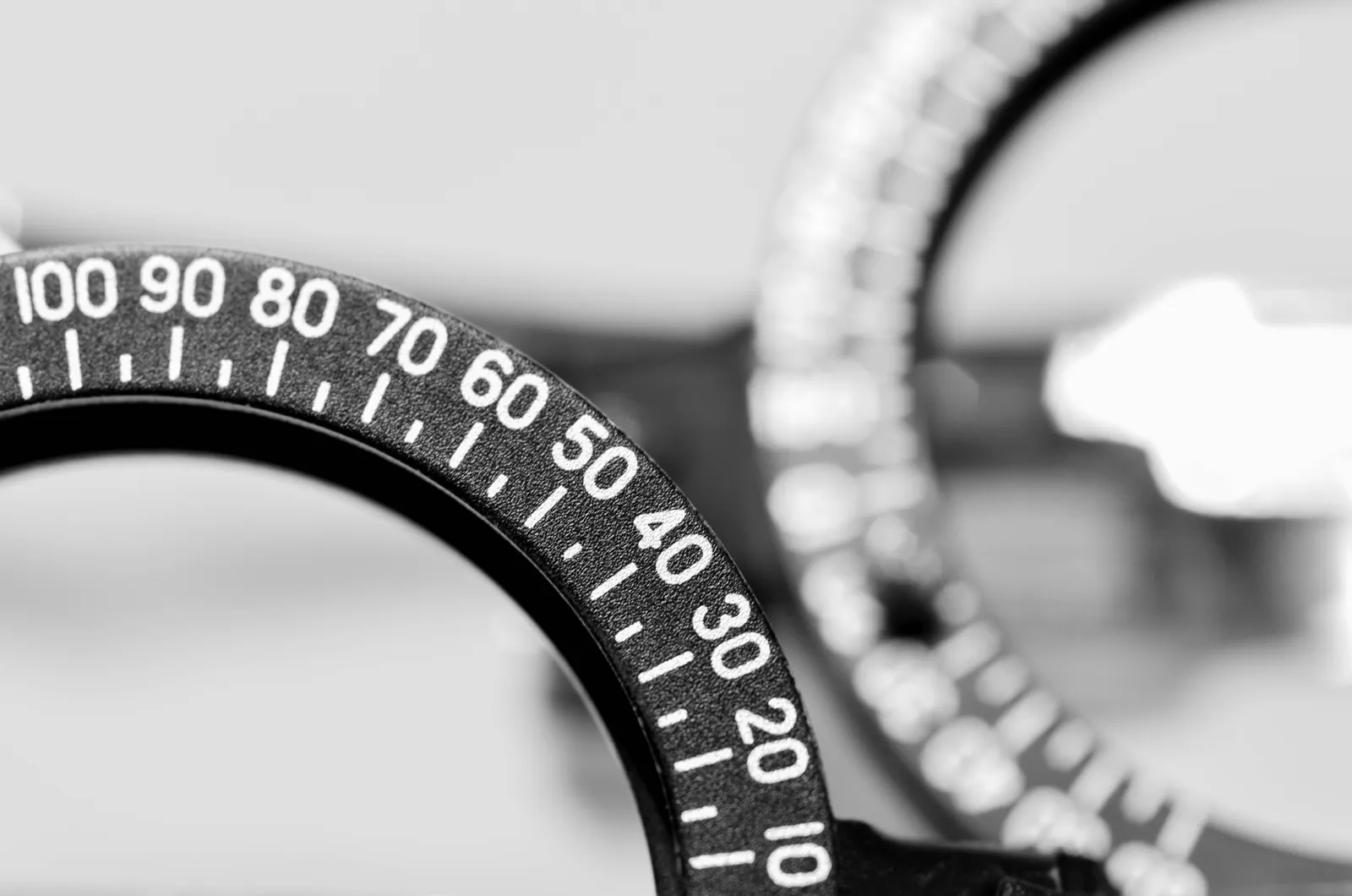 Close-up of an optometric trial frame, the adjustable frame used to test lens and prism prescriptions during an eye examination.