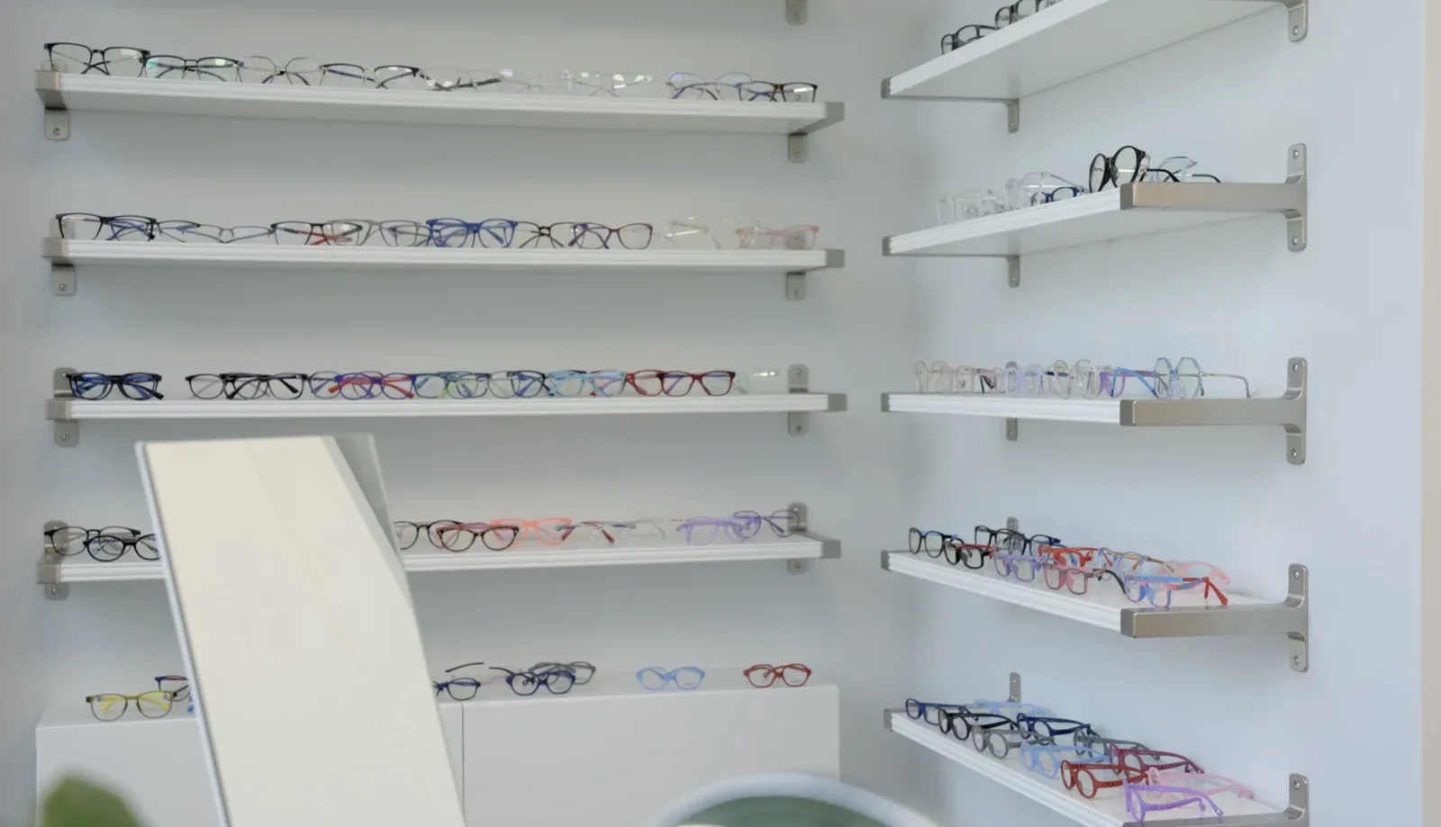 Shelves of eyeglass frames on display at the Boynton Beach office
