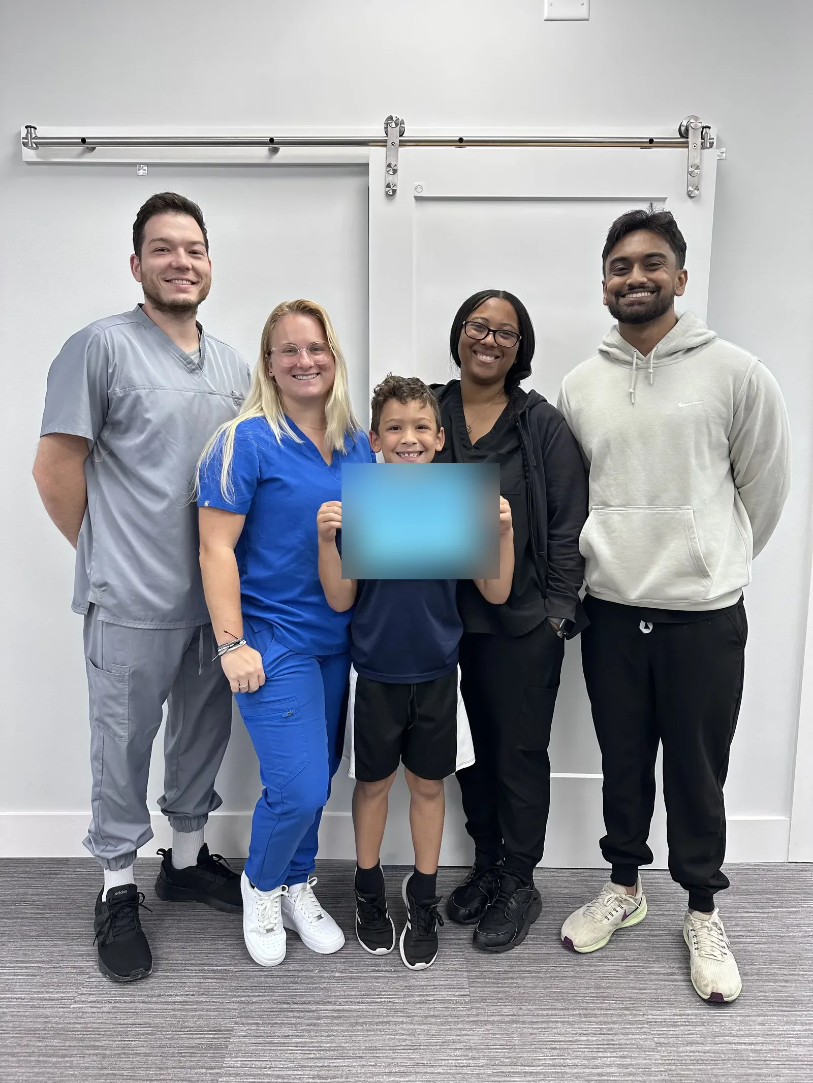 Vision & Learning Center therapists with a patient at the end of their therapy program